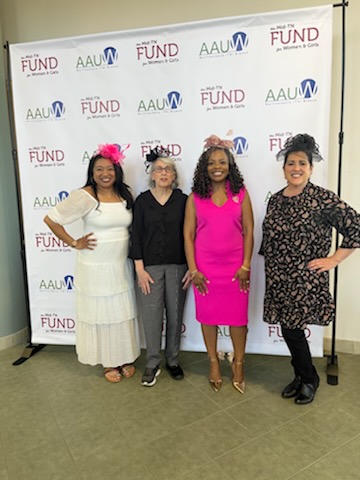 Photo of Christina Cobb, Mary Hoffschwelle, Chandra Story, and L'Oreal Stephens. They are standing in front of a white banner featuring the AAUW logo and the Middle TN Fund for Women and Girls logo.