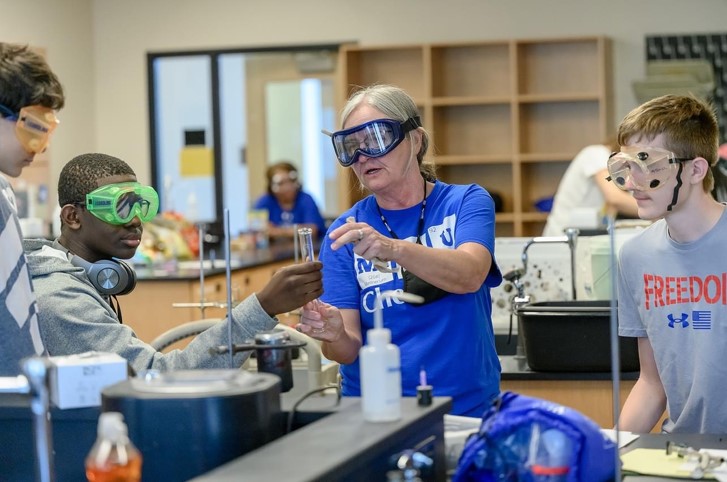 Dr. Phelps and tudents working in a lab