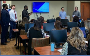 Students present a training to a local business.