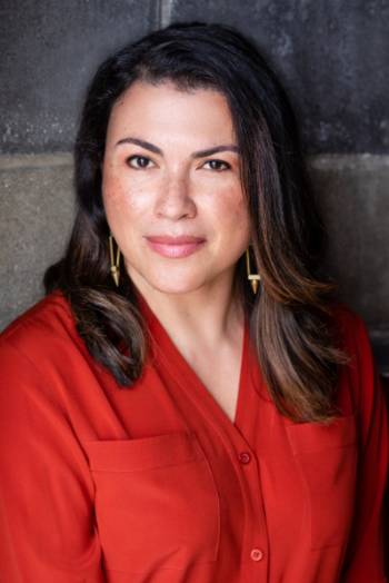 Headshot Portrait of Dr. Lina Britto in a red blazer